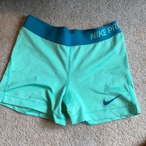 Sea foam green Nike Pros